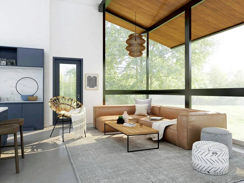 A modern living room with large floor-to-ceiling windows, a tan sectional sofa, and natural wood accents filled with sunlight